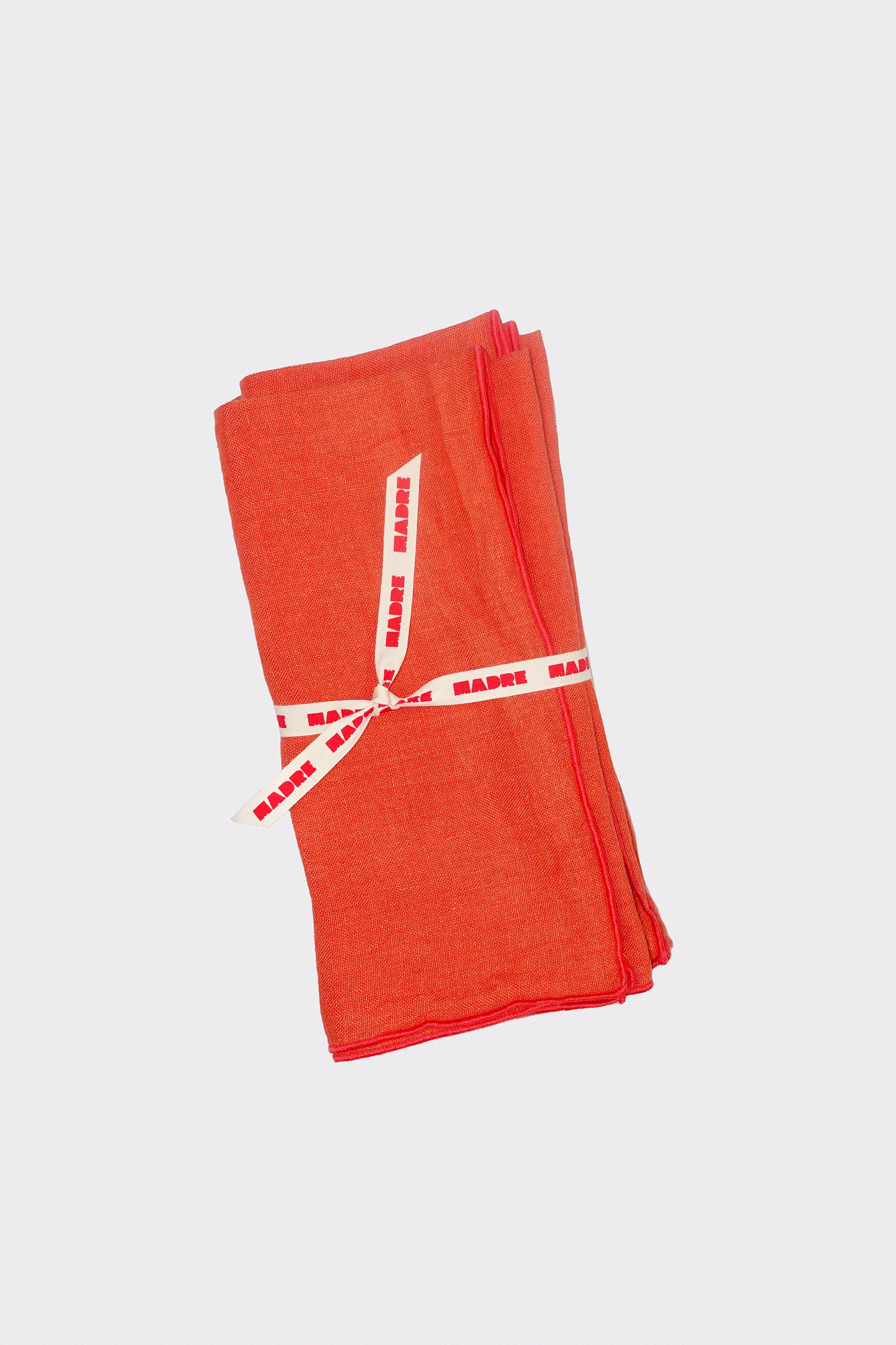 Medium Napkins in Papaya: Set of Four BY MADRE LINEN